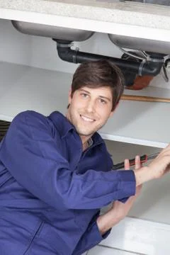 Plumber looking at camera Stock-Fotos