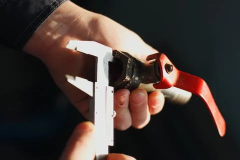 Plumber measures the diameter of the pipe with a caliper tap for plumbing Stock Photos