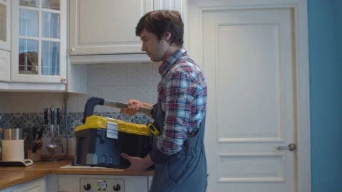 Plumber opening tool box Stock Footage 131211688