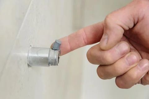 Plumber putting a paste sealant. Stock Photos