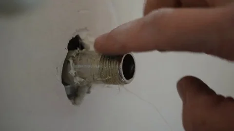 Plumber putting sealant paste on pipe thread Stock Footage 69116612