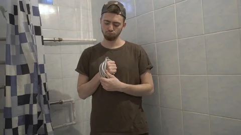 Plumber with shower hose Stock Footage 108307878