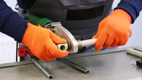 Plumber soldering a plastic pipe Stock Footage 279074594