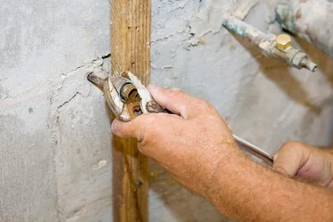 Plumber Tightens Nut Stock Photos