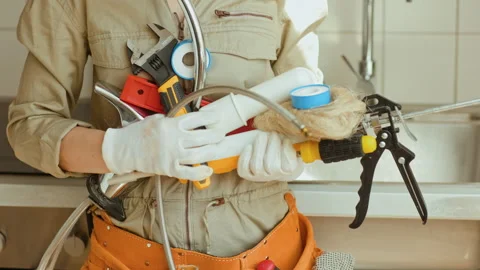 Plumber with Tools Ready for Kitchen Repair Stock Footage 312234653