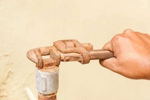 Plumber using a Pipe Wrench Stock Photos