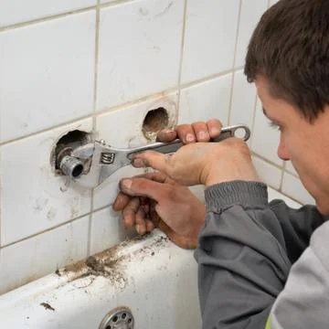Plumber at work Stock Photos