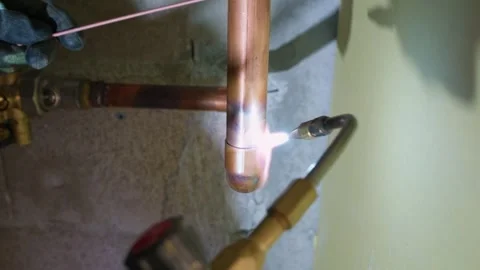 Plumber working on copper Stock Footage 314054910