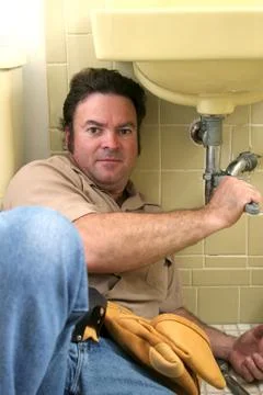 Plumber Working Stock Photos