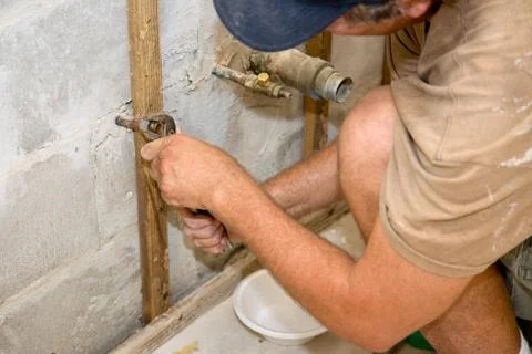 Plumber Working with Pliers Foto stock