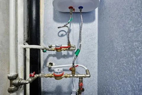 Plumbing layout showcases functional water meters alongside mechanical shut.. Stock Photos