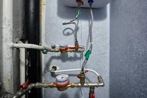 Plumbing layout showcases functional water meters alongside mechanical shut.. Stock Photos