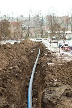 Plumbing pipe laying. Plastic polypropylene pipe. Sanitary, sewer drainage .. Stock Photos