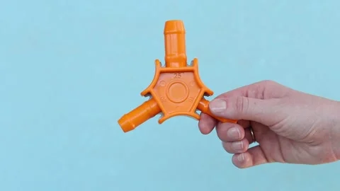 Plumbing tool for calibrating plastic pipes in a woman's hand Stock Footage 338297651