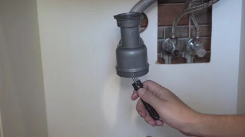 Plumbing work on cleaning the siphon Stock Footage 314260315