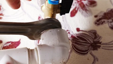 Plumbing work to fix pipe leaks and connect water purification filter hose Stock Footage 308519912