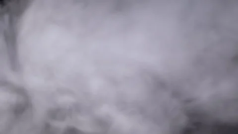 Plumes of Thick Icy Clouds of Smoke or Steam Fill the Space in Blurry Motion Stock Footage 253772800