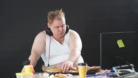 Plump computer programmer browsing the net Stock Footage 105427762