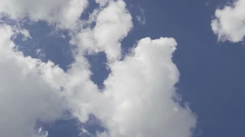 Plump Fluffy Clouds Cover the Blue Sky in Clear Daytime Weather. Time Lapse of P Stock Footage 138151021