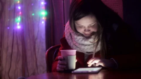 Plump Girl working on tablet drinking tea Stock Footage 71897093
