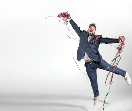 Plump guy in a jumping pose Stock Photos