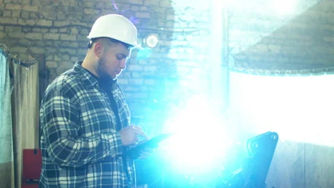Plump male employee using tablet in factory workshop Stock Footage 152488415
