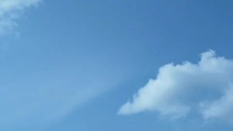 A Plump White Cloud Dissolves Transforms and Flies Away Clearing the Clear Blue  Stock Footage 151320945