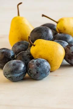 Plums and pears Stock Photos