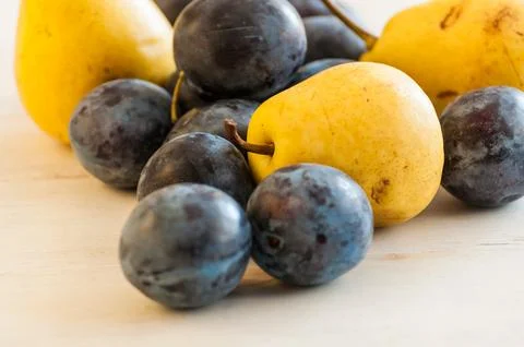 Plums and pears Stock Photos