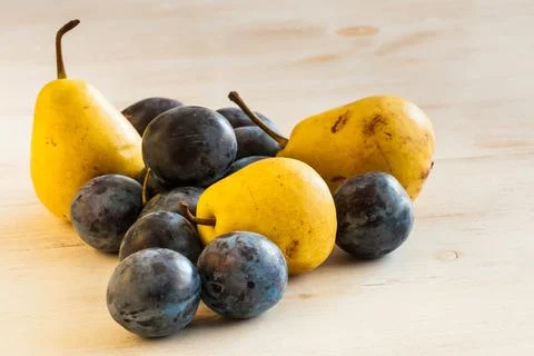 Plums and pears Stock Photos