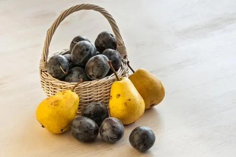 Plums and pears Stock Photos