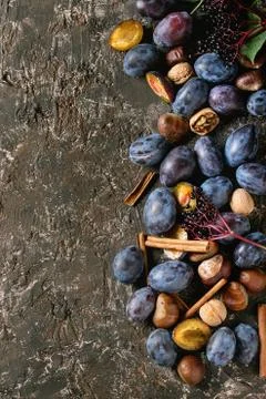 Plums and walnuts Stock Photos