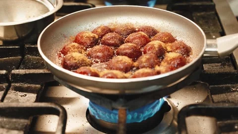 Plums Caramelizing in Brown Sugar in a Pan Over a Gas Flame 스톡 동영상 348329977