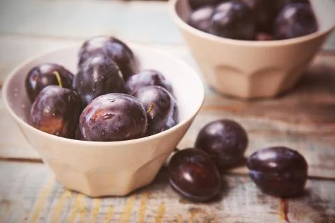 Plums in dish Stock Photos