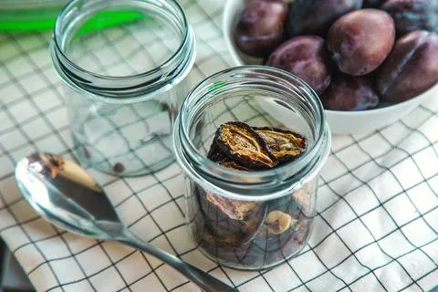 Plums dried in a dehydrator. Selective focus. Stock Photos