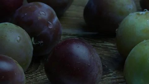 Plums fall on the desk 스톡 동영상 79679018