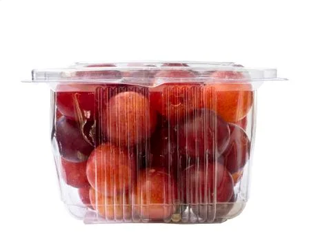 Plums fruit in plastic pack Stock Photos