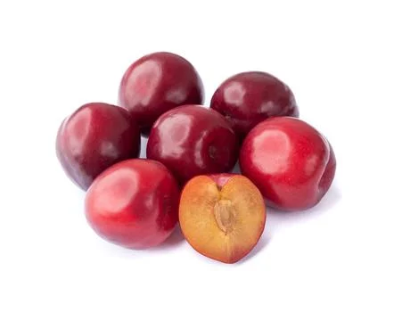 Plums with half fruit isolated over white background Stock Photos