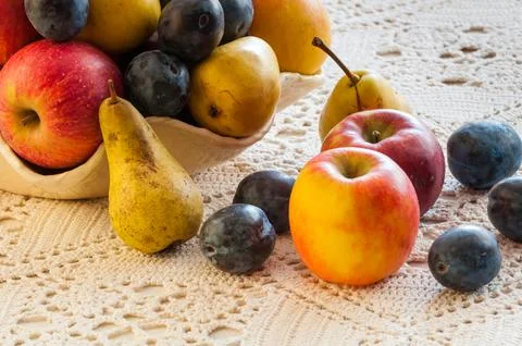 Plums, pears and apples Stock Photos