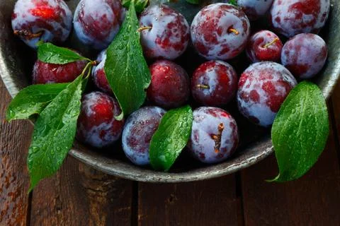 Plums on a wooden table Stock Photos