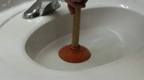 Plunging a sink Stock Footage 13869384