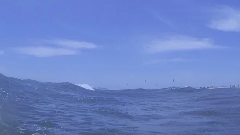 Plunging into the waves, fast air bubbles rising Stock Footage 83484360