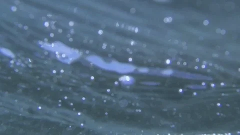 Plunging into the waves, fast air bubbles rising Stock Footage 83485449