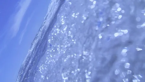 Plunging into the waves, fast air bubbles rising Stock Footage 83487037