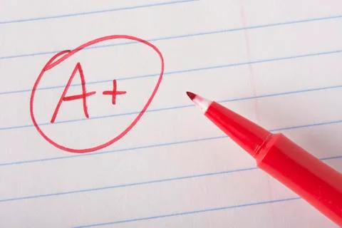 A plus grade with pen Stock Photos