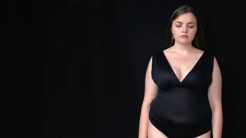 Plus-size beautiful lady sadly looking at camera, place for your adv, template Stock Footage 139039059
