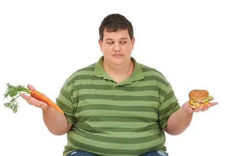 Plus size, diet decision and man with a carrot and fast food choice thinking Stock Photos