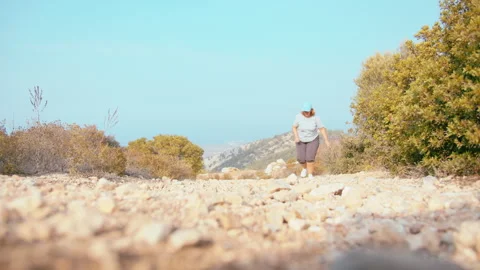 Plus Size Female Runner Doing Exercise in Mountain Landscape in Sunset Colors Stock Footage 329933324