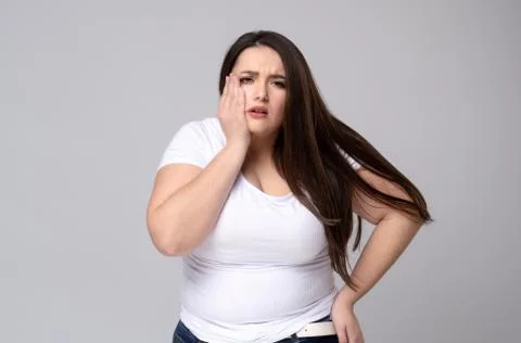 Plus Size Model with a hand holding a sore tooth Stock Photos