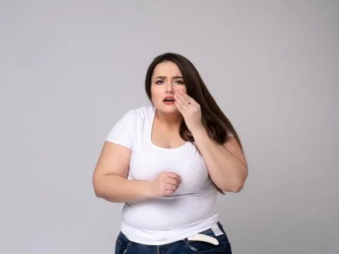 Plus Size Model with a hand holding a sore tooth Stock Photos